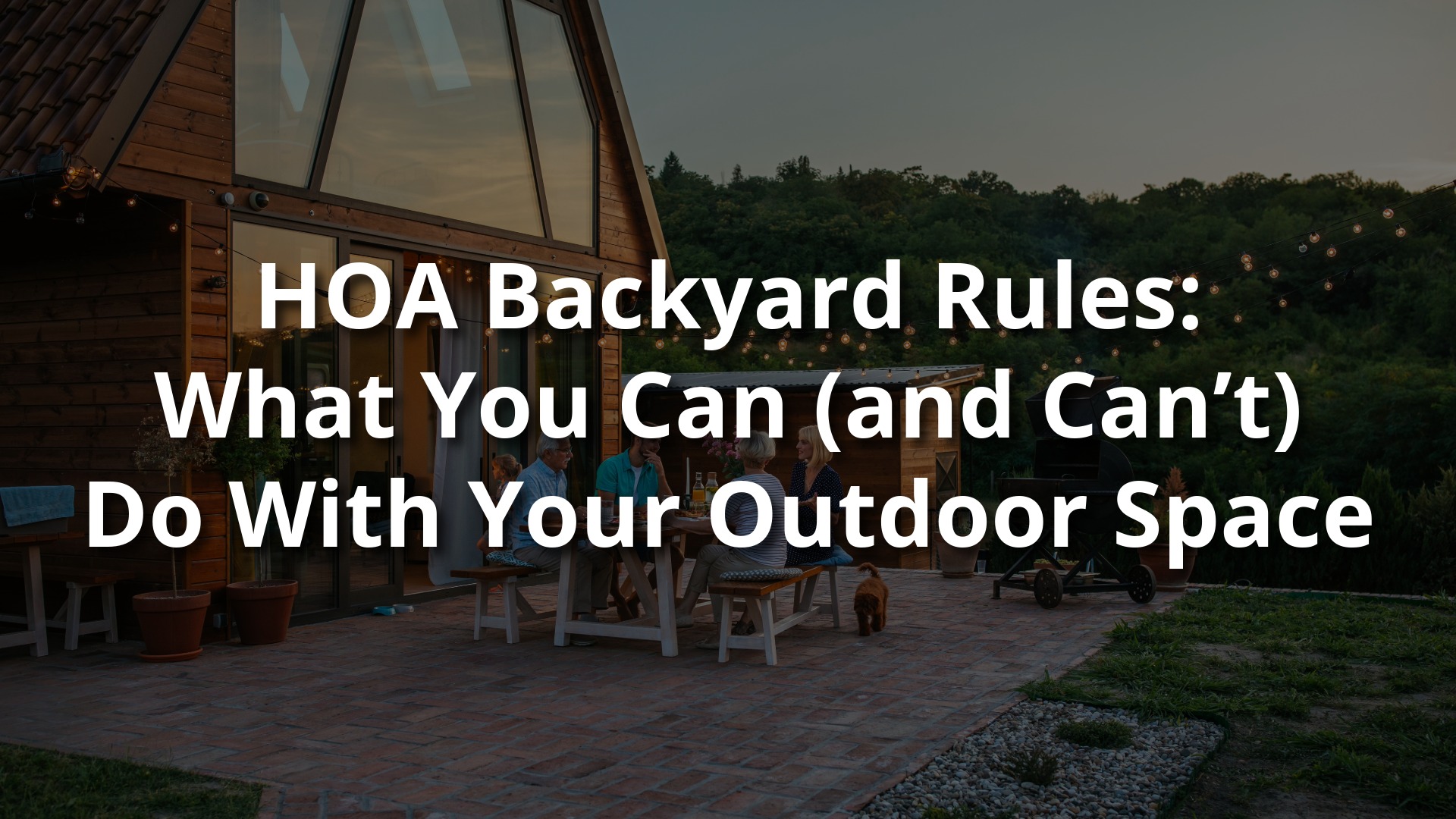 Group of people gathered on a well-kept backyard patio with outdoor lighting, seating, and a grill—representing HOA backyard use and outdoor space rules.